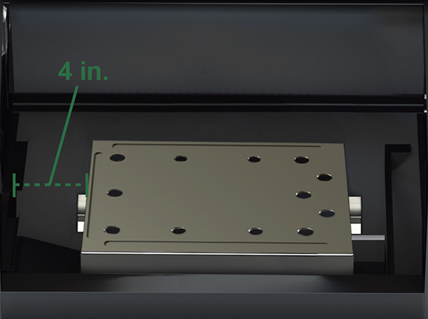 Heat shield installation guide for TREK Prime WiFi pellet grill, showing a metal shield placed 4 inches from the left wall, with visible mounting holes for proper alignment.